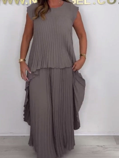 🌸 Set aus plissiertem, kurzärmligem, unregelmäßigem Midi-Top und Hose mit weitem Bein und elastischer Taille